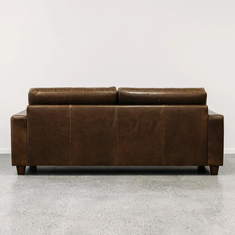 Coco leather sofa in greenstone monarch